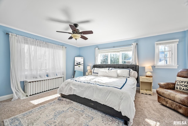 bedroom with crown molding, radiator heating unit, and carpet