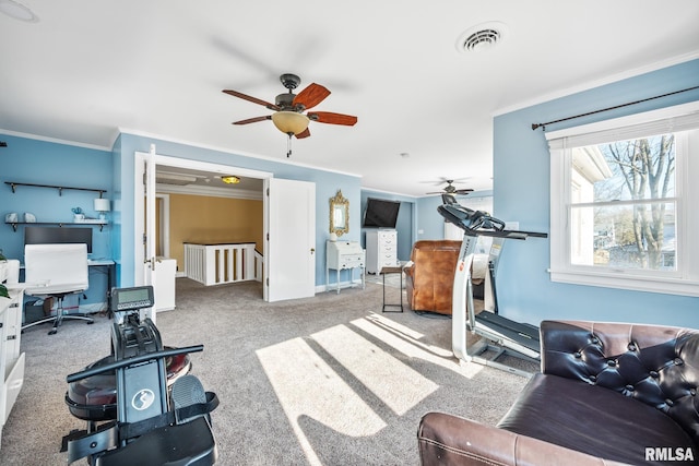 exercise room with crown molding, light carpet, and ceiling fan