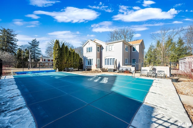 exterior space with a patio and a covered pool