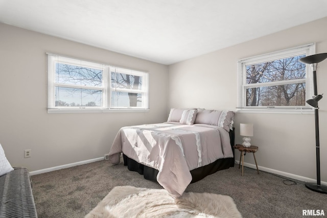 carpeted bedroom featuring multiple windows