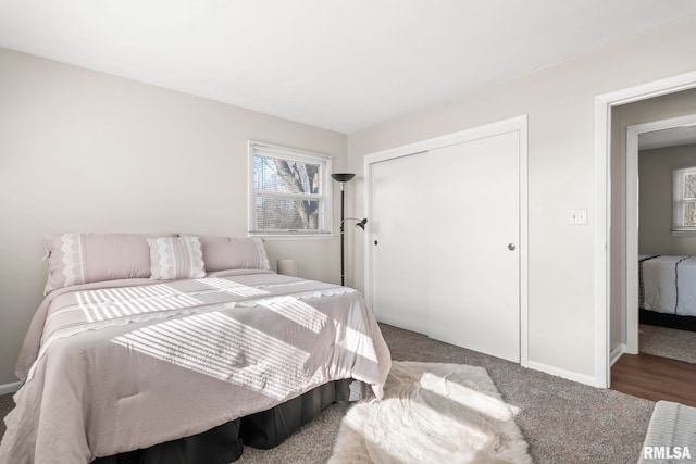 carpeted bedroom featuring a closet