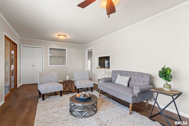 living room with crown molding, ceiling fan, and dark hardwood / wood-style flooring