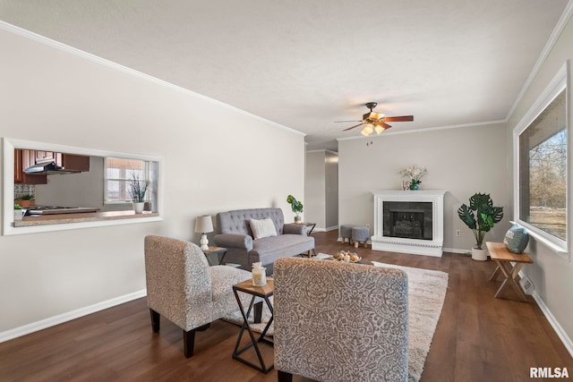 living room with dark wood-type flooring, ornamental molding, and ceiling fan