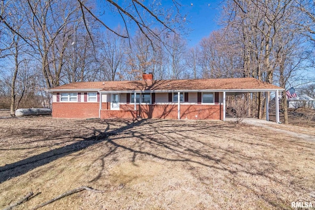 ranch-style home with a carport