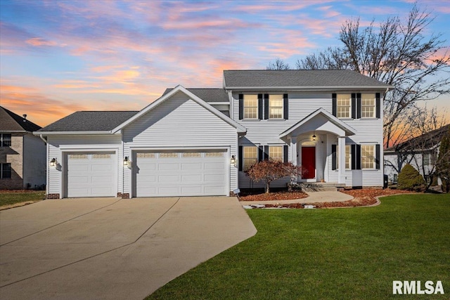 colonial-style house with a garage and a lawn