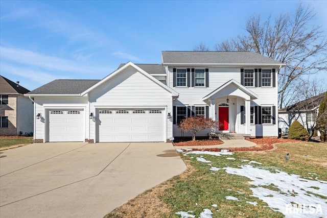 colonial home featuring a garage and a front yard