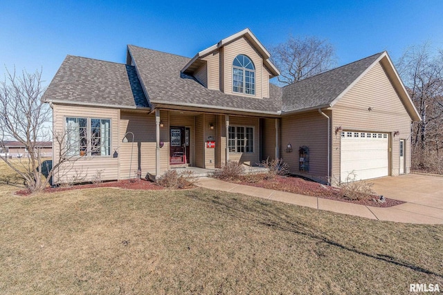 view of front of home featuring a garage and a front lawn