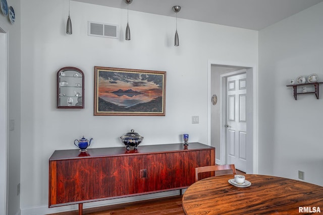 interior space with wood-type flooring and baseboard heating