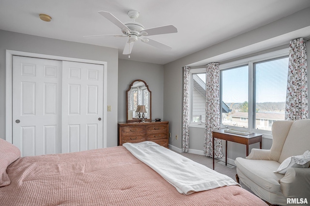 bedroom featuring carpet flooring, ceiling fan, and a closet