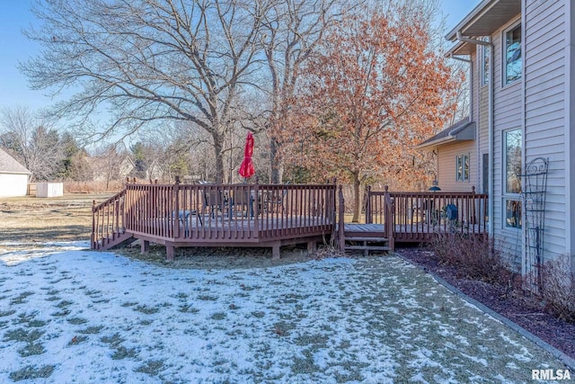 view of snow covered deck