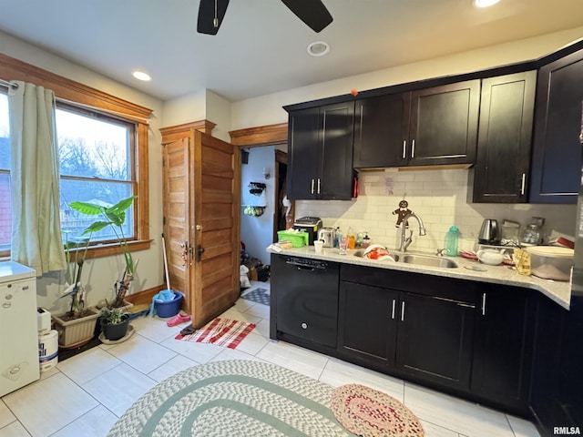 kitchen featuring sink, ceiling fan, black dishwasher, light tile patterned flooring, and decorative backsplash