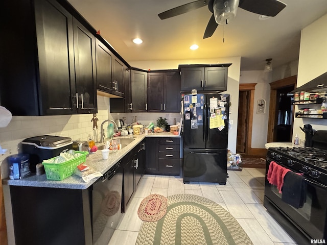 kitchen with washer / clothes dryer, tasteful backsplash, sink, ceiling fan, and black appliances