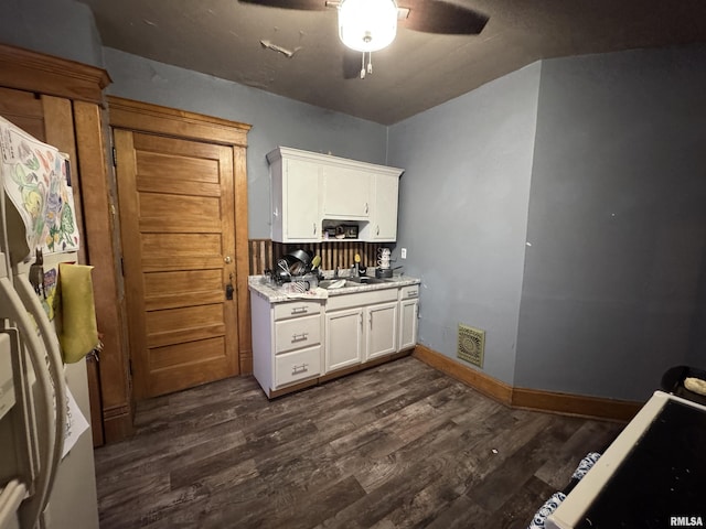 kitchen featuring white cabinetry, dark wood-type flooring, and ceiling fan