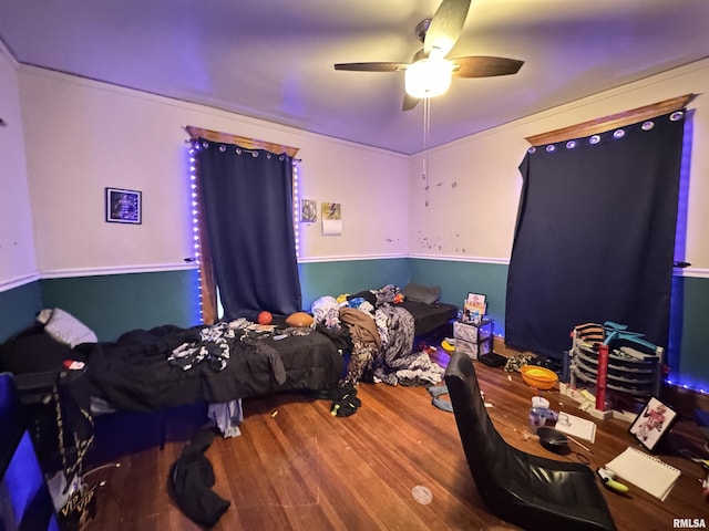 bedroom featuring ceiling fan and wood-type flooring