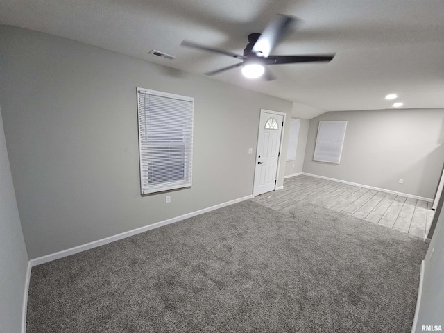 empty room featuring ceiling fan and carpet flooring