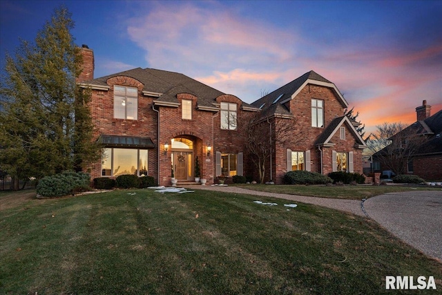 view of front of house with a lawn