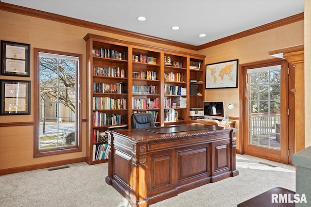 home office with ornamental molding and light colored carpet