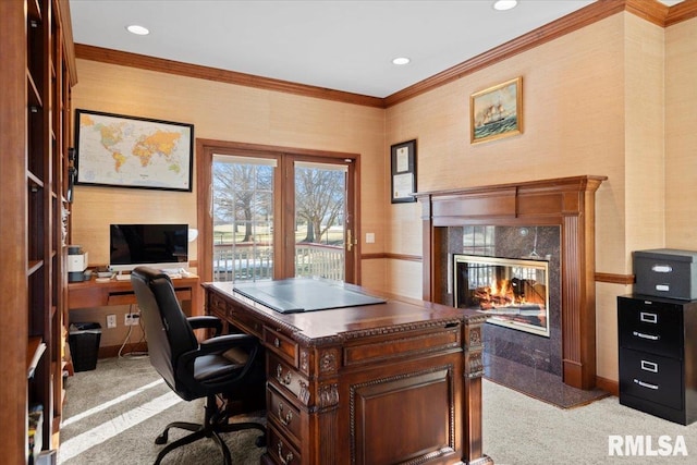 carpeted office space featuring a premium fireplace and crown molding