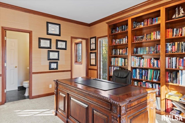 home office featuring light carpet and crown molding