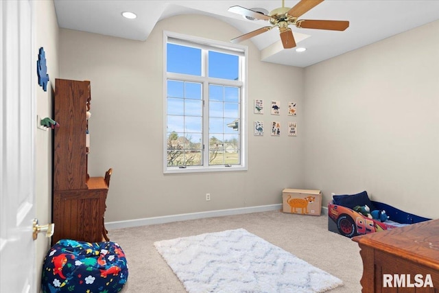 bedroom featuring light colored carpet and ceiling fan