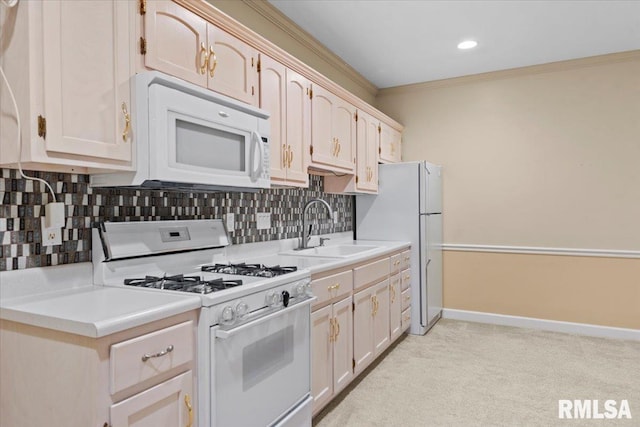 kitchen featuring sink, tasteful backsplash, crown molding, light carpet, and white appliances