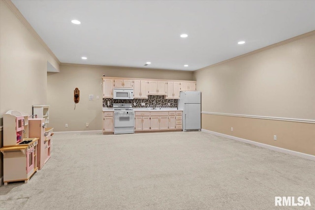 kitchen with crown molding, white appliances, light colored carpet, and tasteful backsplash