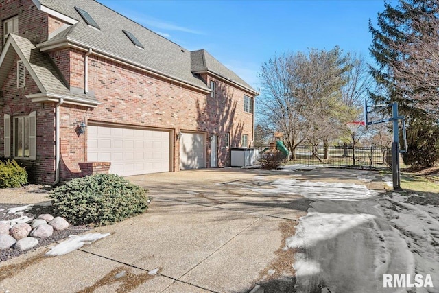 view of side of property featuring a garage