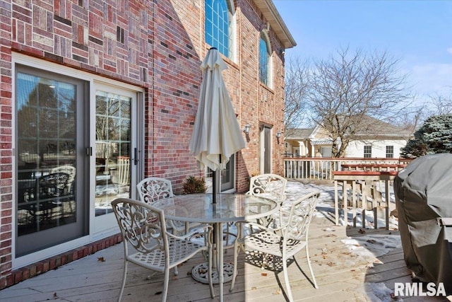 wooden deck with grilling area