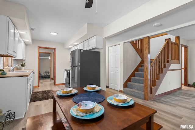 34187 E 6th Rd, Pawnee, IL 62558 - dining space with stairway, visible vents, a ceiling fan, light wood-style floors, and baseboards