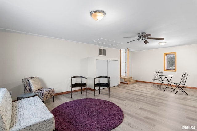 34187 E 6th Rd, Pawnee, IL 62558 - sitting room with wood finished floors, visible vents, a ceiling fan, baseboards, and attic access