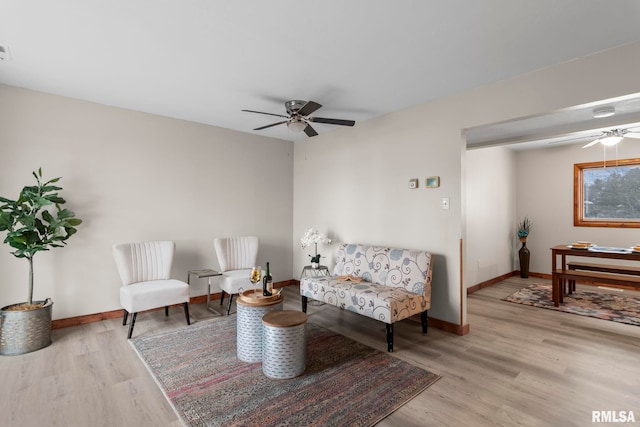 34187 E 6th Rd, Pawnee, IL 62558 - living area with visible vents, baseboards, wood finished floors, and ceiling fan