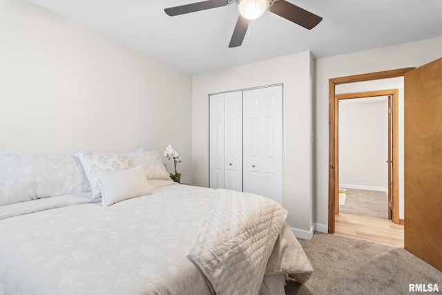 34187 E 6th Rd, Pawnee, IL 62558 - bedroom with a closet, a ceiling fan, baseboards, and light carpet