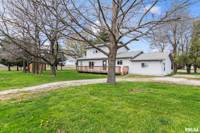 34187 E 6th Rd, Pawnee, IL 62558 - view of front of property featuring a deck, a front yard, and curved driveway