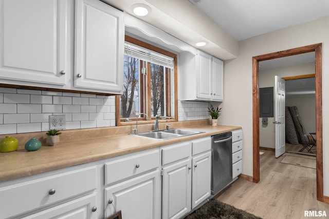 34187 E 6th Rd, Pawnee, IL 62558 - kitchen with light wood finished floors, light countertops, white cabinets, and a sink