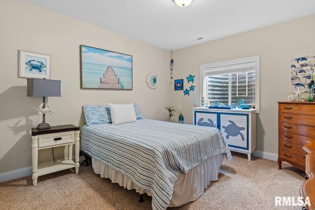 bedroom featuring light colored carpet