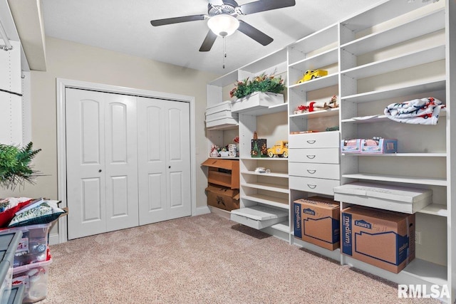 interior space with light carpet and ceiling fan