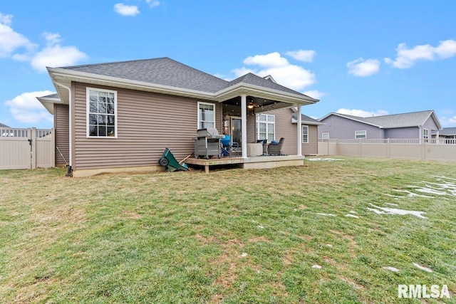 rear view of house with a lawn