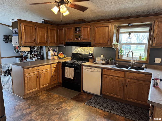 kitchen with sink, decorative light fixtures, a textured ceiling, dishwasher, and black gas stove