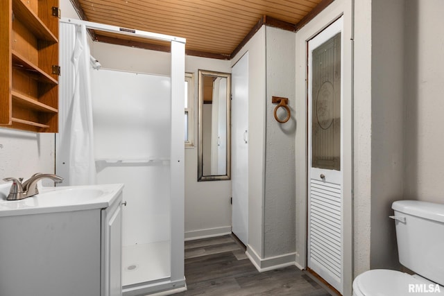 bathroom with vanity, toilet, hardwood / wood-style floors, and wooden ceiling