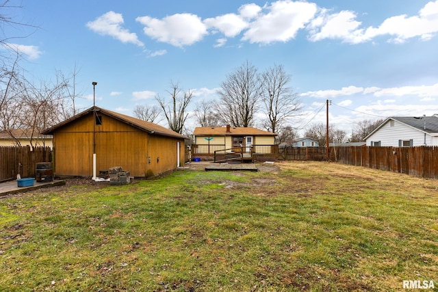 exterior space featuring a wooden deck and a lawn