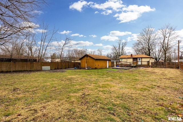 view of yard featuring a deck and a shed