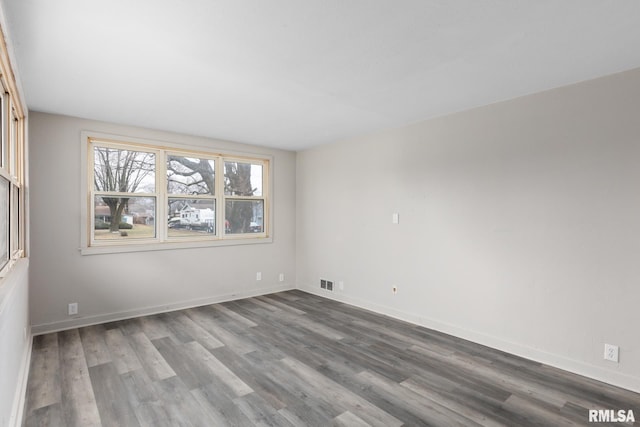 unfurnished room featuring hardwood / wood-style floors