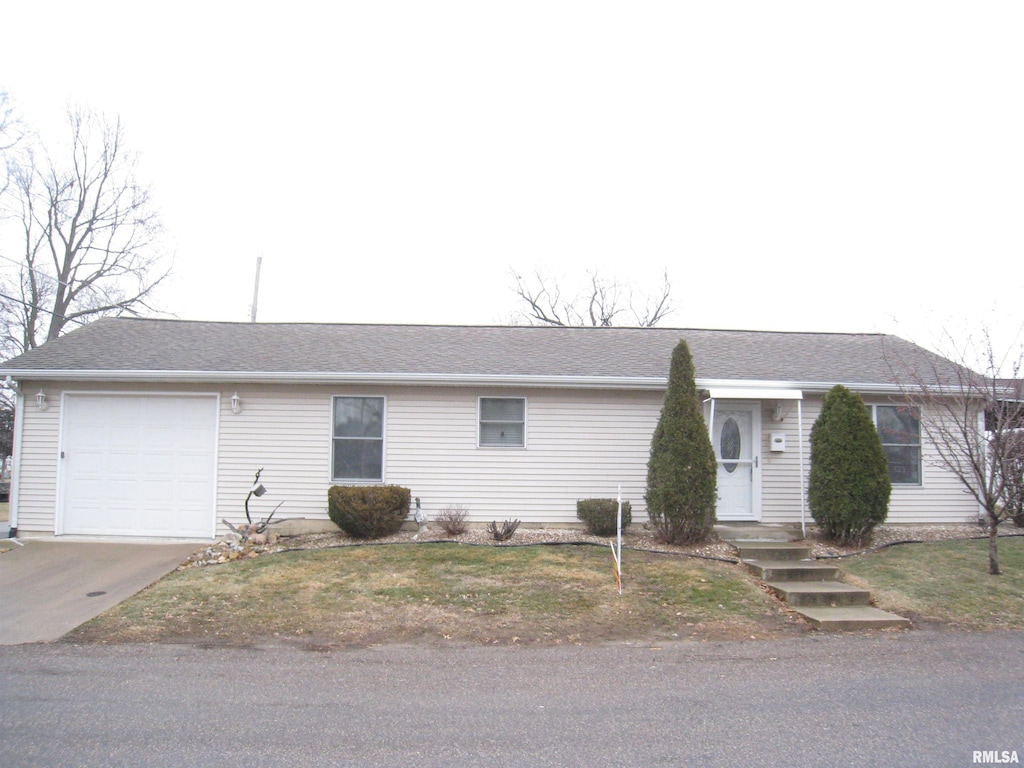 single story home featuring a garage