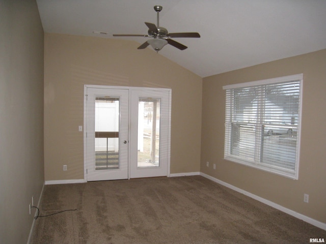 unfurnished room with vaulted ceiling, carpet floors, ceiling fan, and french doors