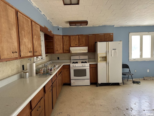 kitchen featuring white appliances and sink