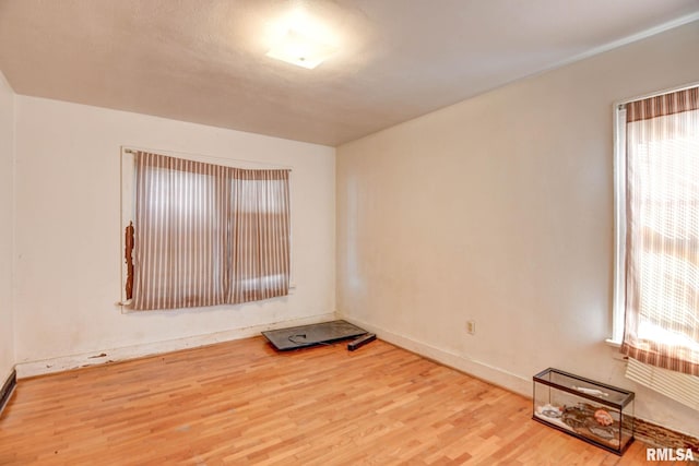 spare room featuring hardwood / wood-style floors