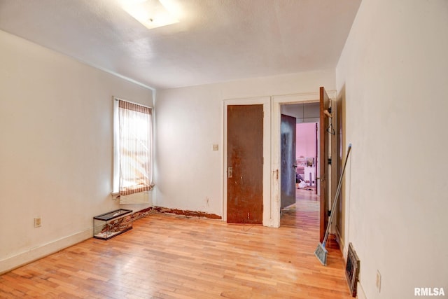 empty room with light wood-type flooring