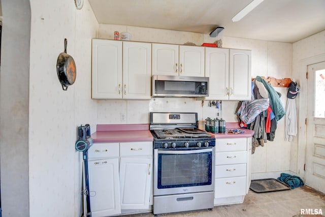 kitchen with stainless steel appliances and white cabinets