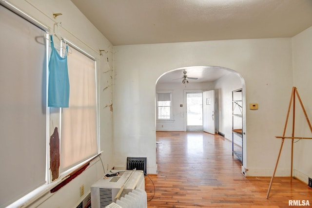 foyer featuring ceiling fan and wood-type flooring