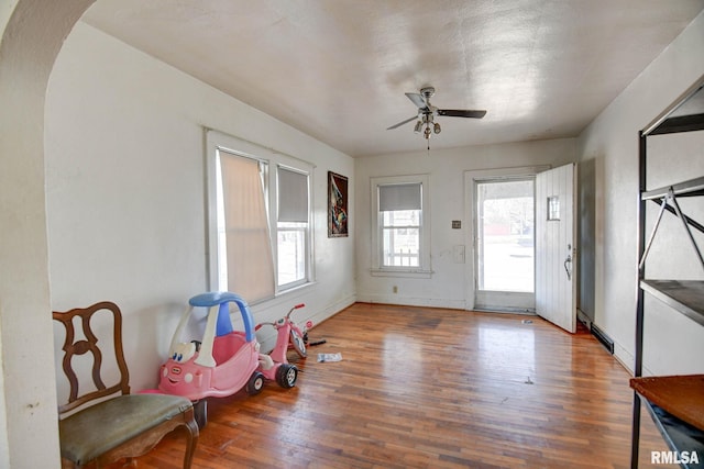 interior space with hardwood / wood-style flooring and ceiling fan